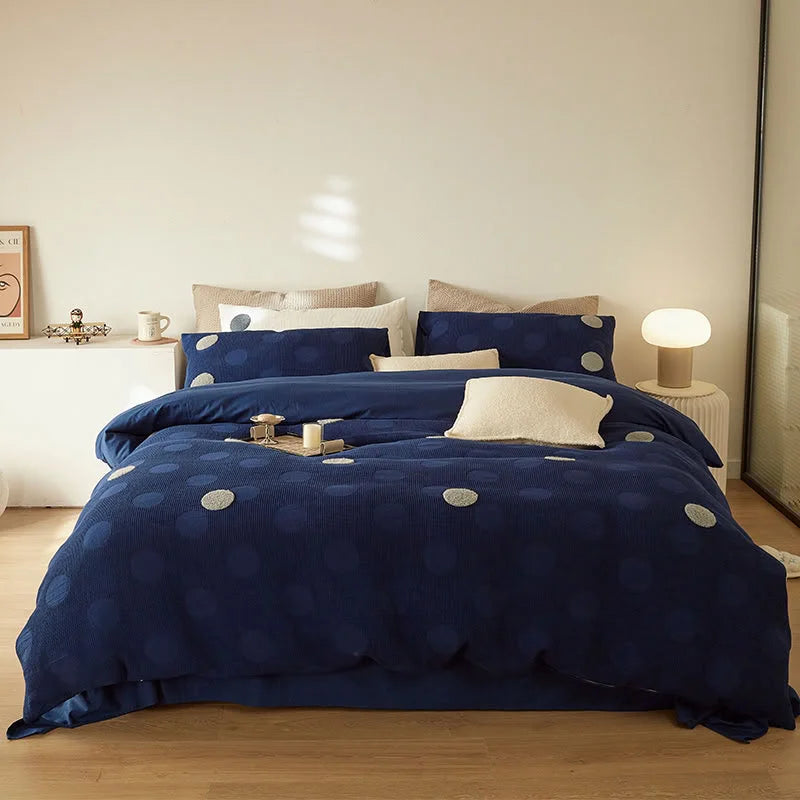 Full view of the Navy Polka Dot Flannel Fleece Bedding Set styled on a modern bed in a minimalist room. - RoomDen
