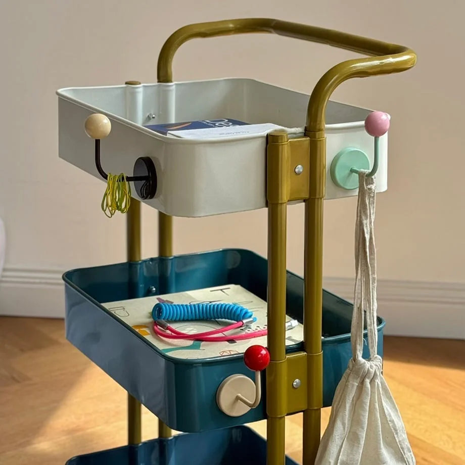 Another angle of the colorful metal hooks attached to a multi-tiered rolling storage cart - RoomDen.