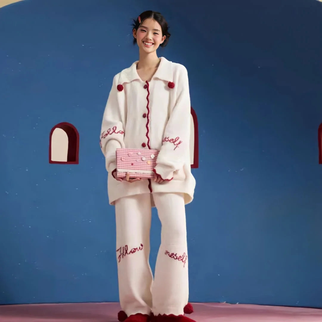 Full view of the plush Cream White embroidered fleece pajama set on a smiling model. - RoomDen