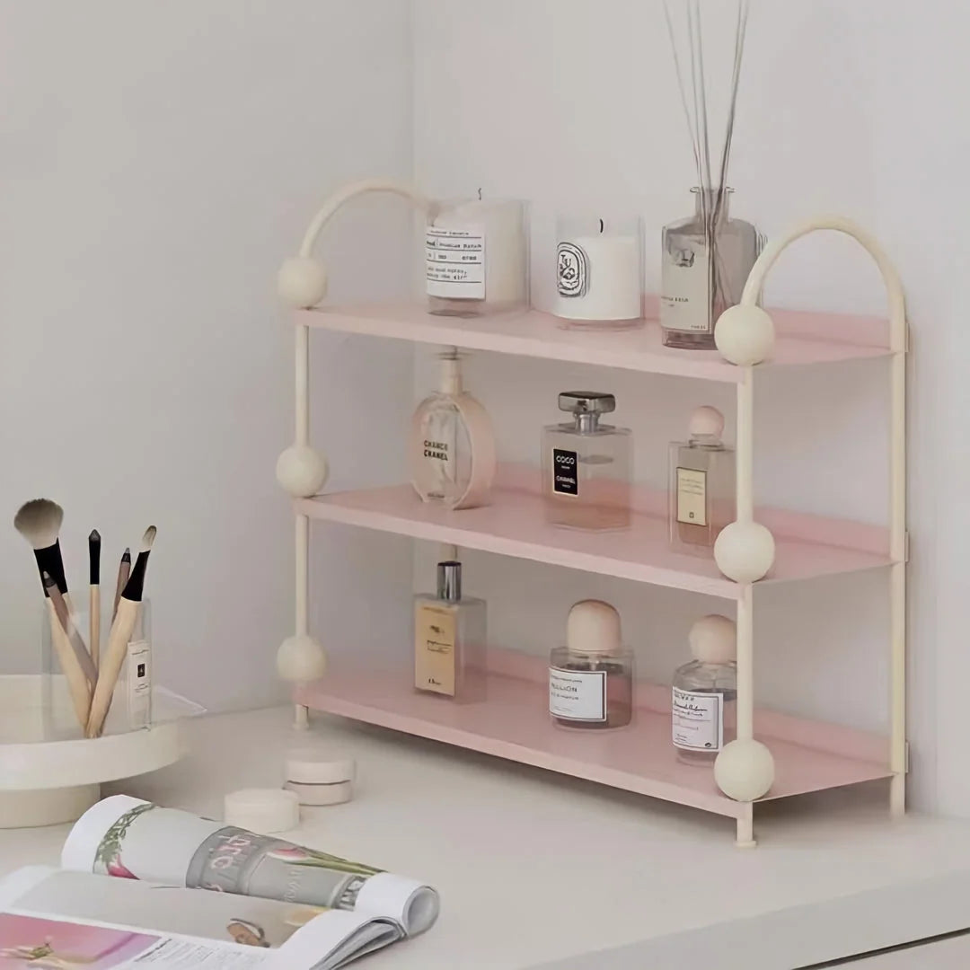 Corner view of the Pastel Pink & Cream vanity shelf, neatly organizing makeup brushes and perfumes - RoomDen.
