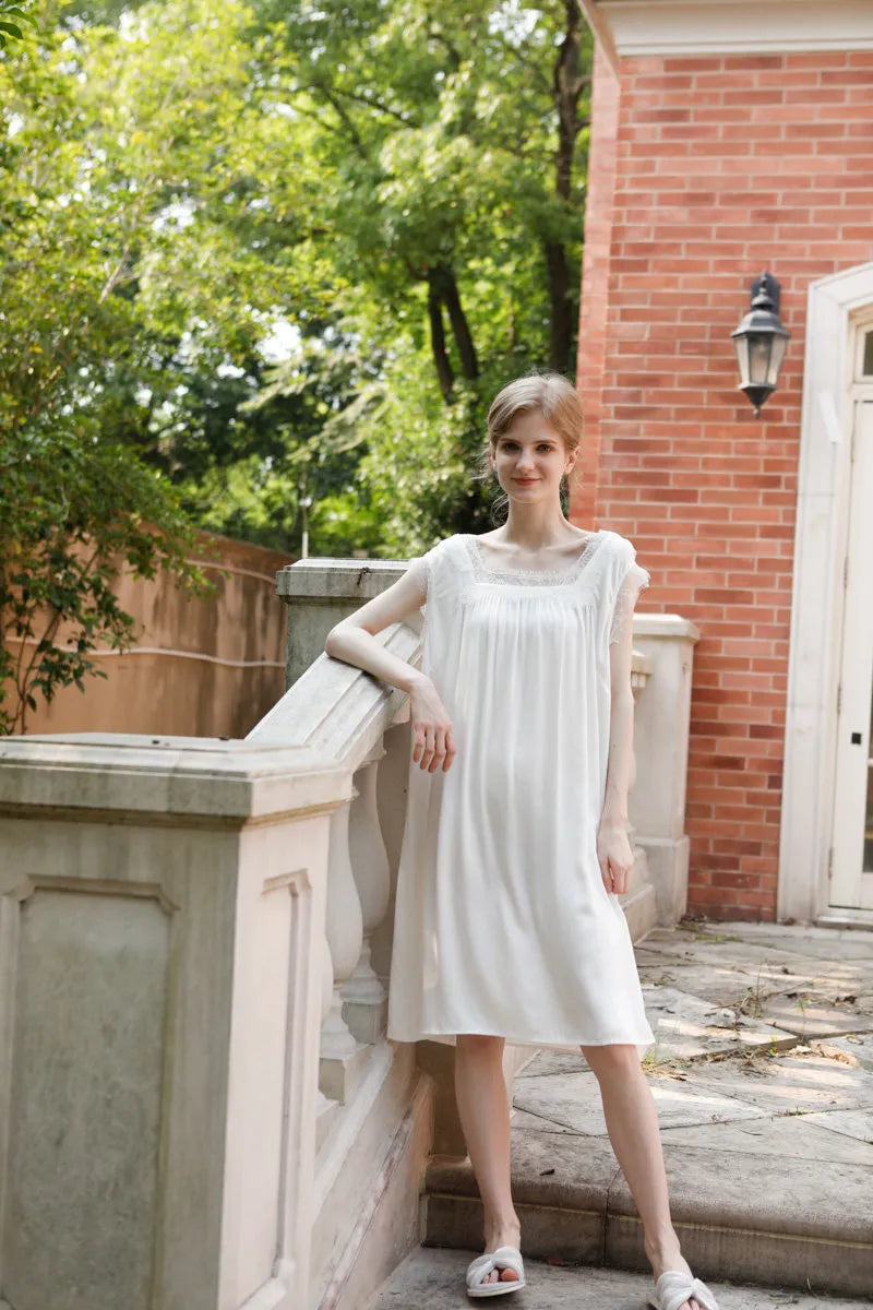 Full length view of white pajama dress on garden terrace - RoomDen