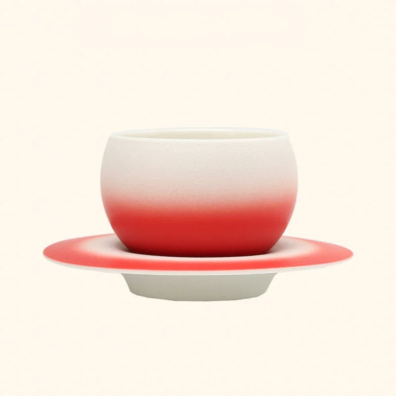 A second view of the Crimson Red Ombre Ceramic Cup and Saucer Set. - RoomDen