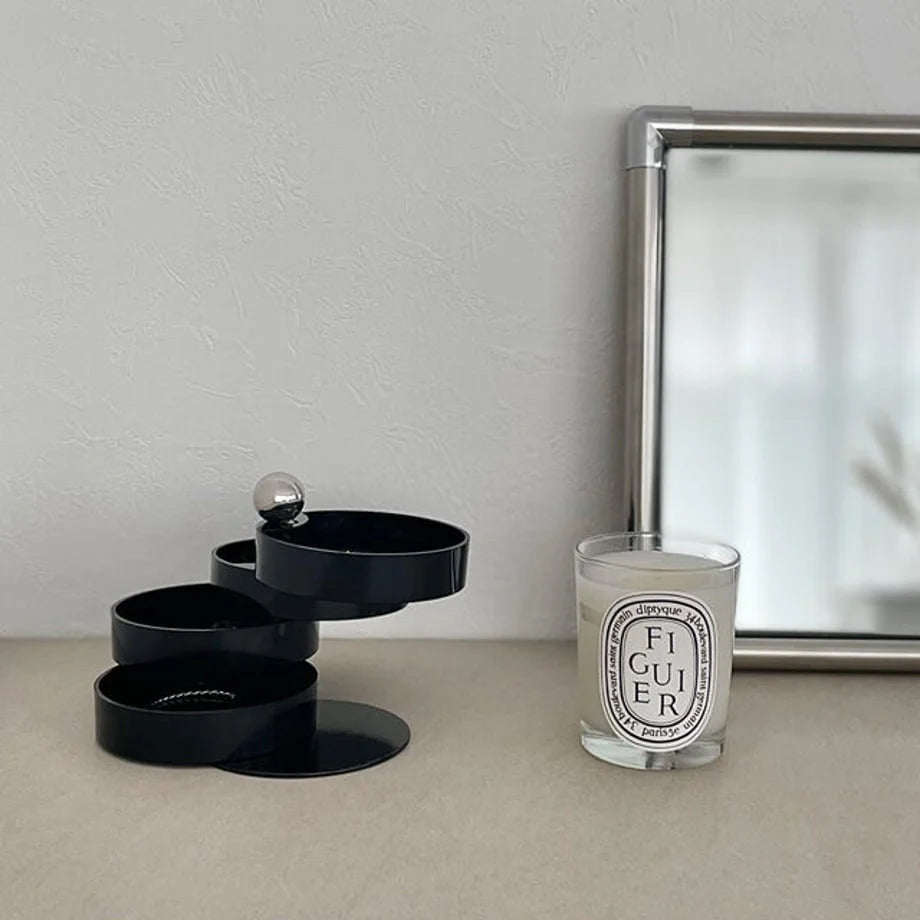 The Matte Black jewelry organizer with its tiers swiveled out in a cascading formation. - RoomDen