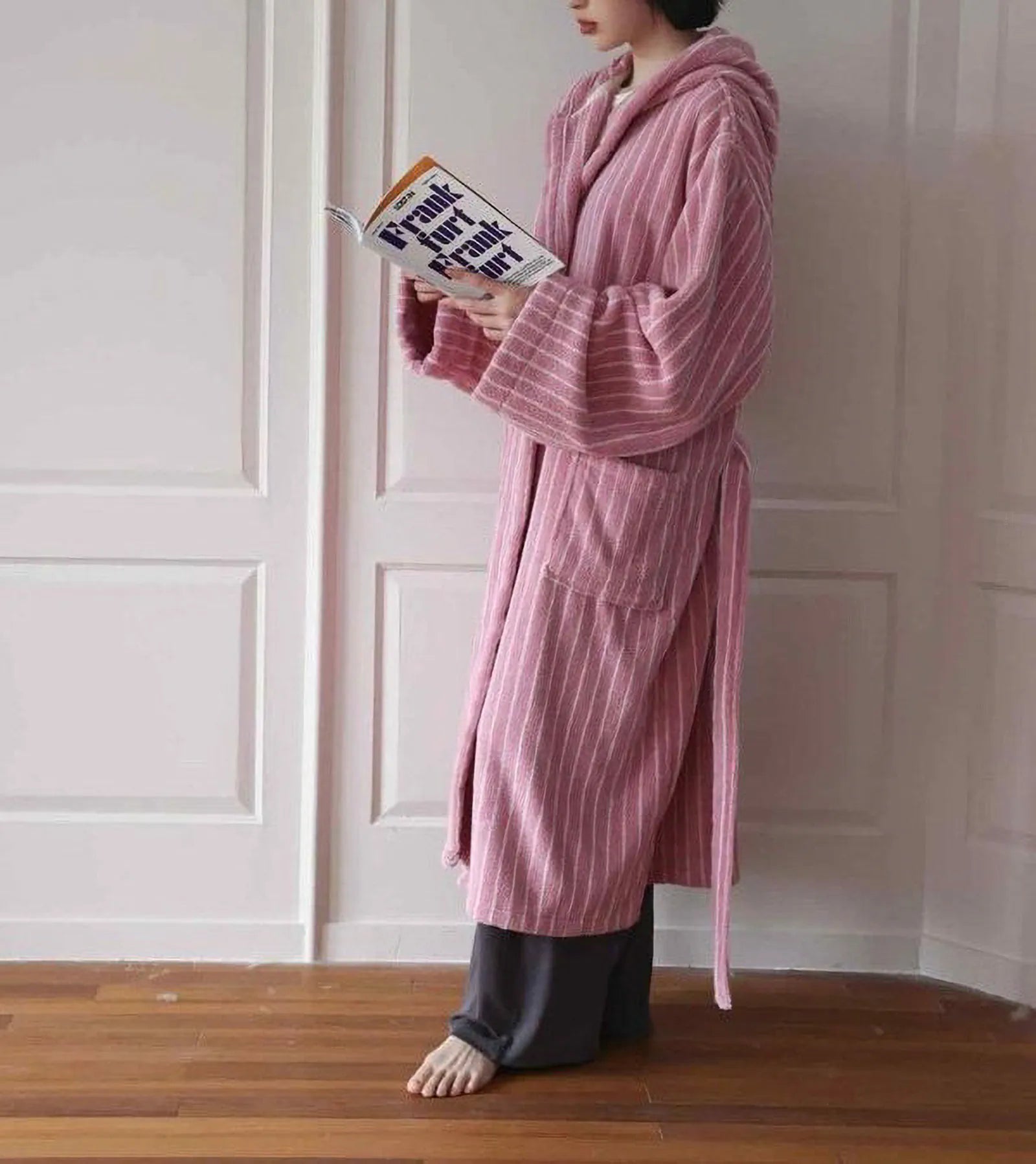 Full length view of the plush cotton robe in pink stripes, styled with grey lounge pants - RoomDen