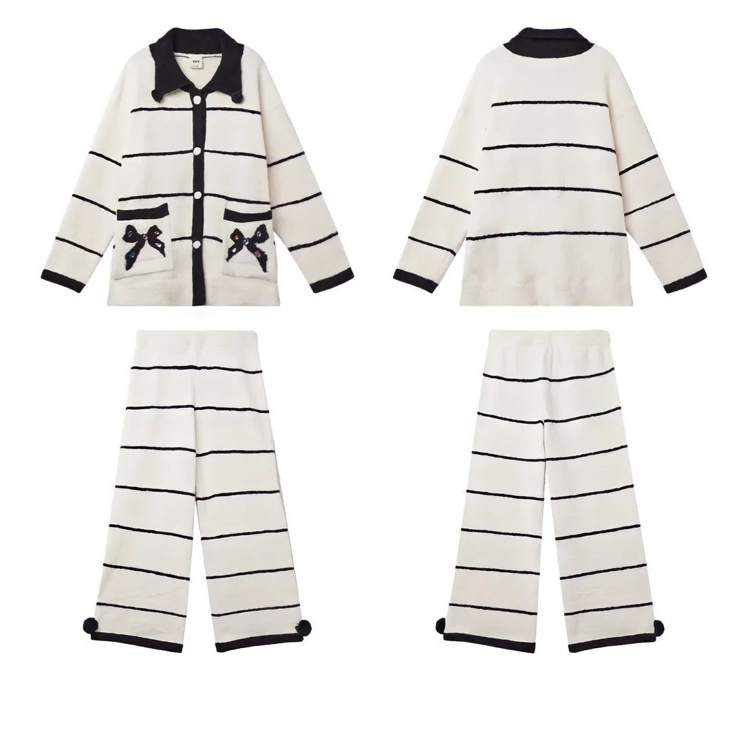 Flatlay image showing the front and back of the striped fleece pajama top and pants set on a white background - RoomDen.