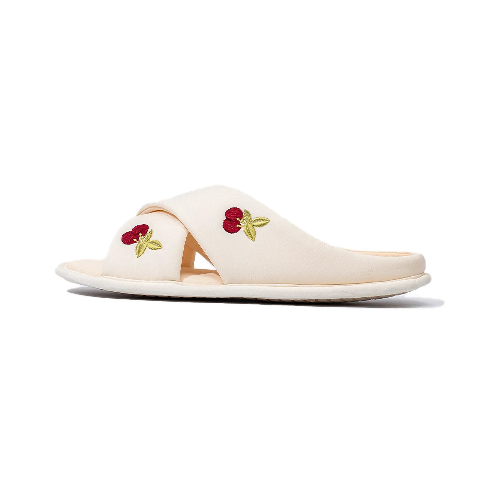 Low angle side view of white embroidered cherry slippers - RoomDen
