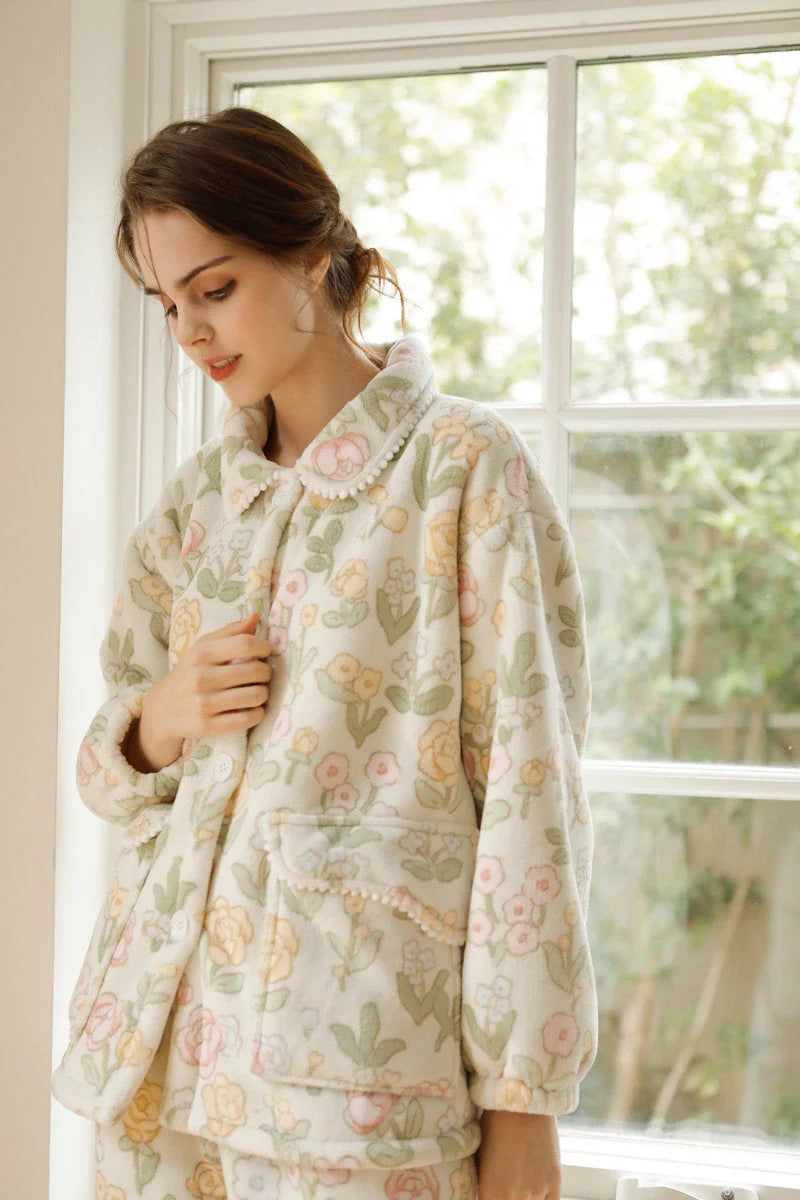 Close up of floral print and button details on plush pajama top - RoomDen
