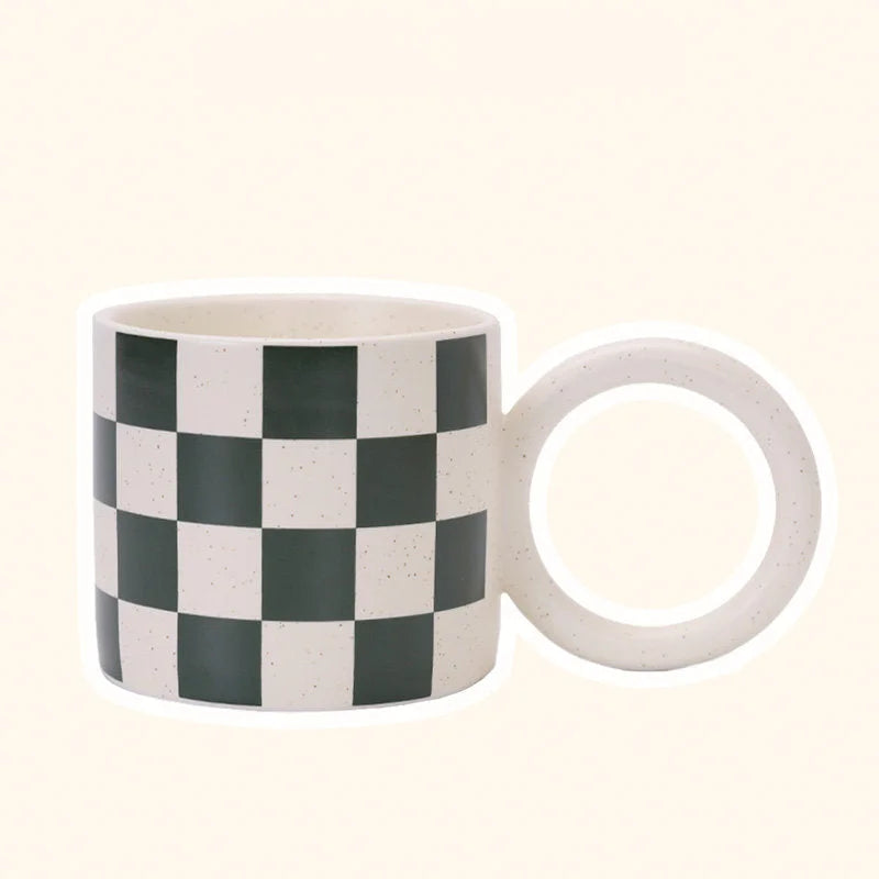 Angled view of the Green Checkered Ceramic Mug with an Oversized Handle. - RoomDen