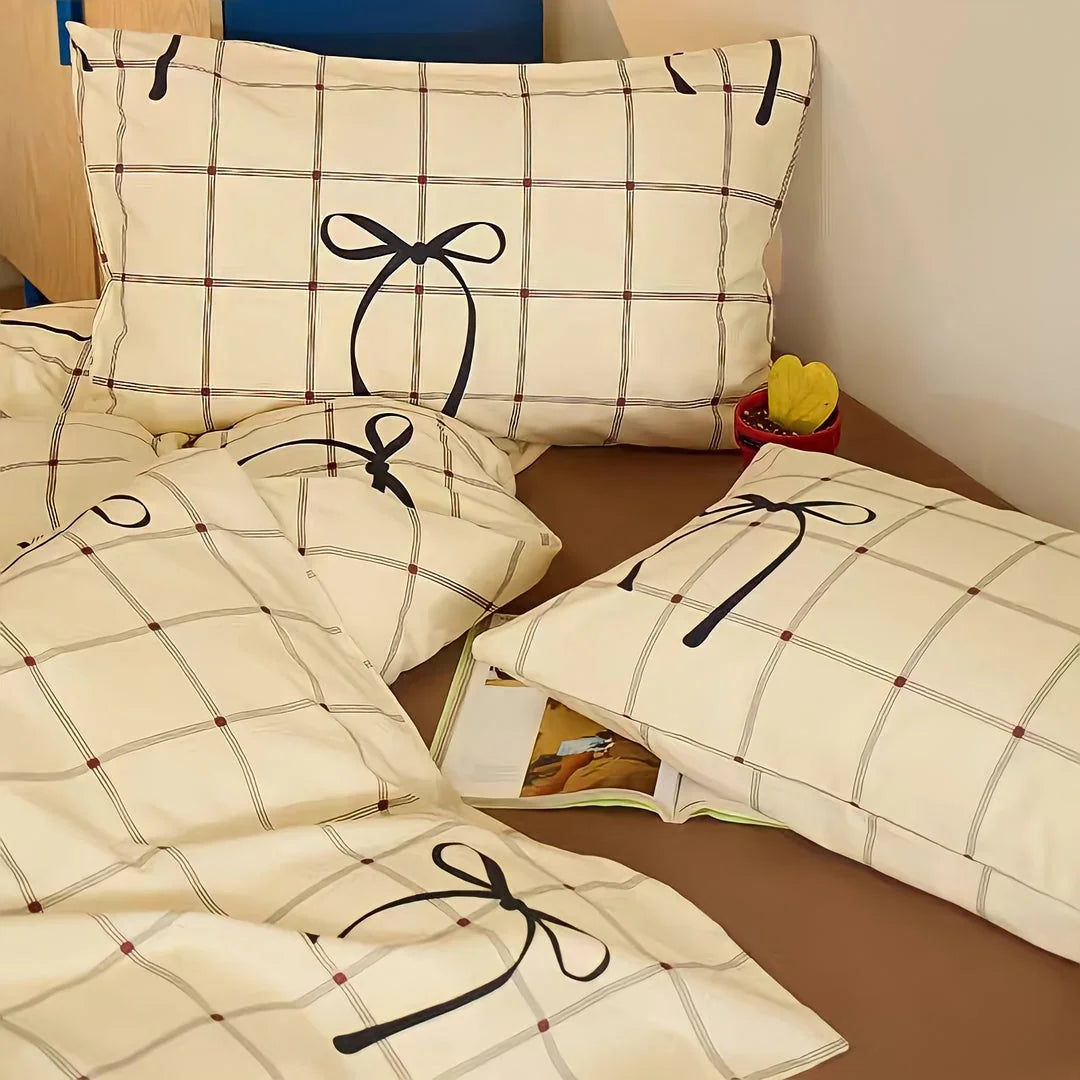 Angled view of the Coquette-style bow plaid duvet cover and pillowcases. - RoomDen