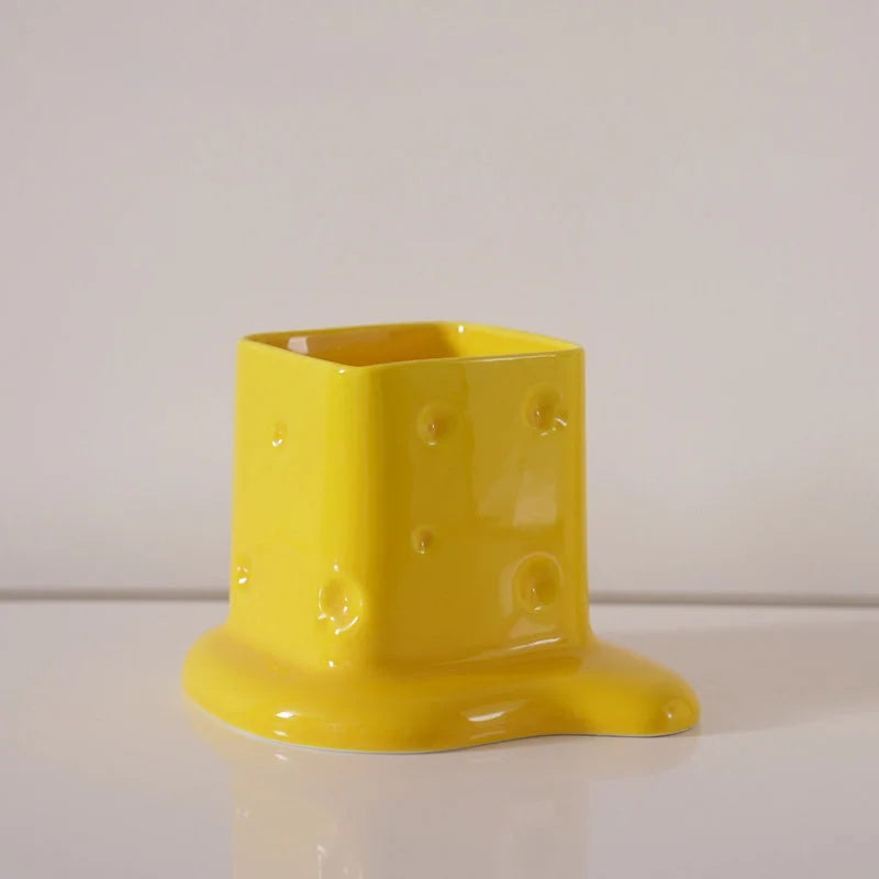 Close-up of the Yellow melting cheese ceramic desktop organizer on a white background. - RoomDen