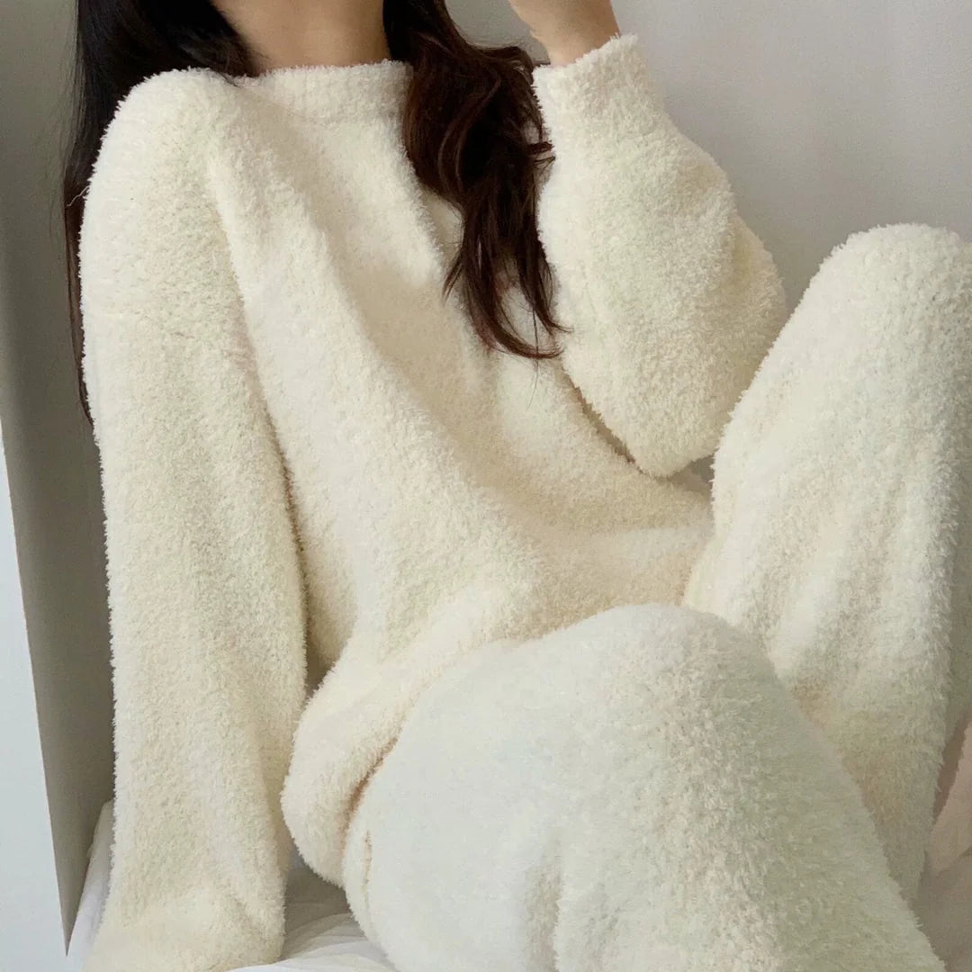 Close-up of a woman in a Cream White plush fleece pajama top, highlighting the soft texture - RoomDen