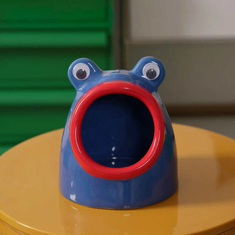 A blue and red Googly Eye Frog ceramic organizer, showing a color variant. - RoomDen