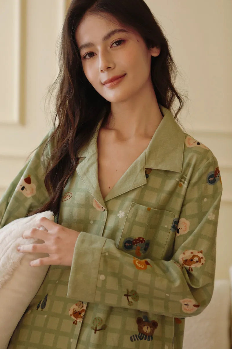Front view of button-down pajama top featuring cute woodland motifs and chest pocket