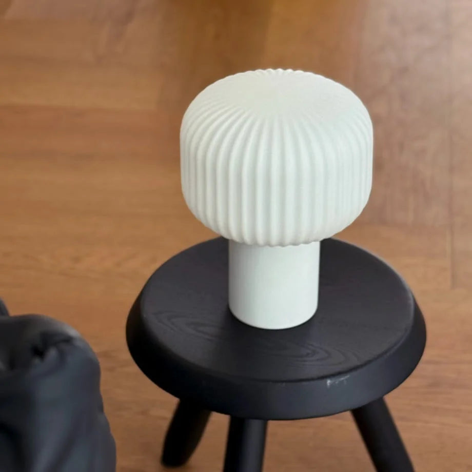 The Creamy White Pleated Glass Mushroom Accent Lamp unlit, showing its textured surface - RoomDen