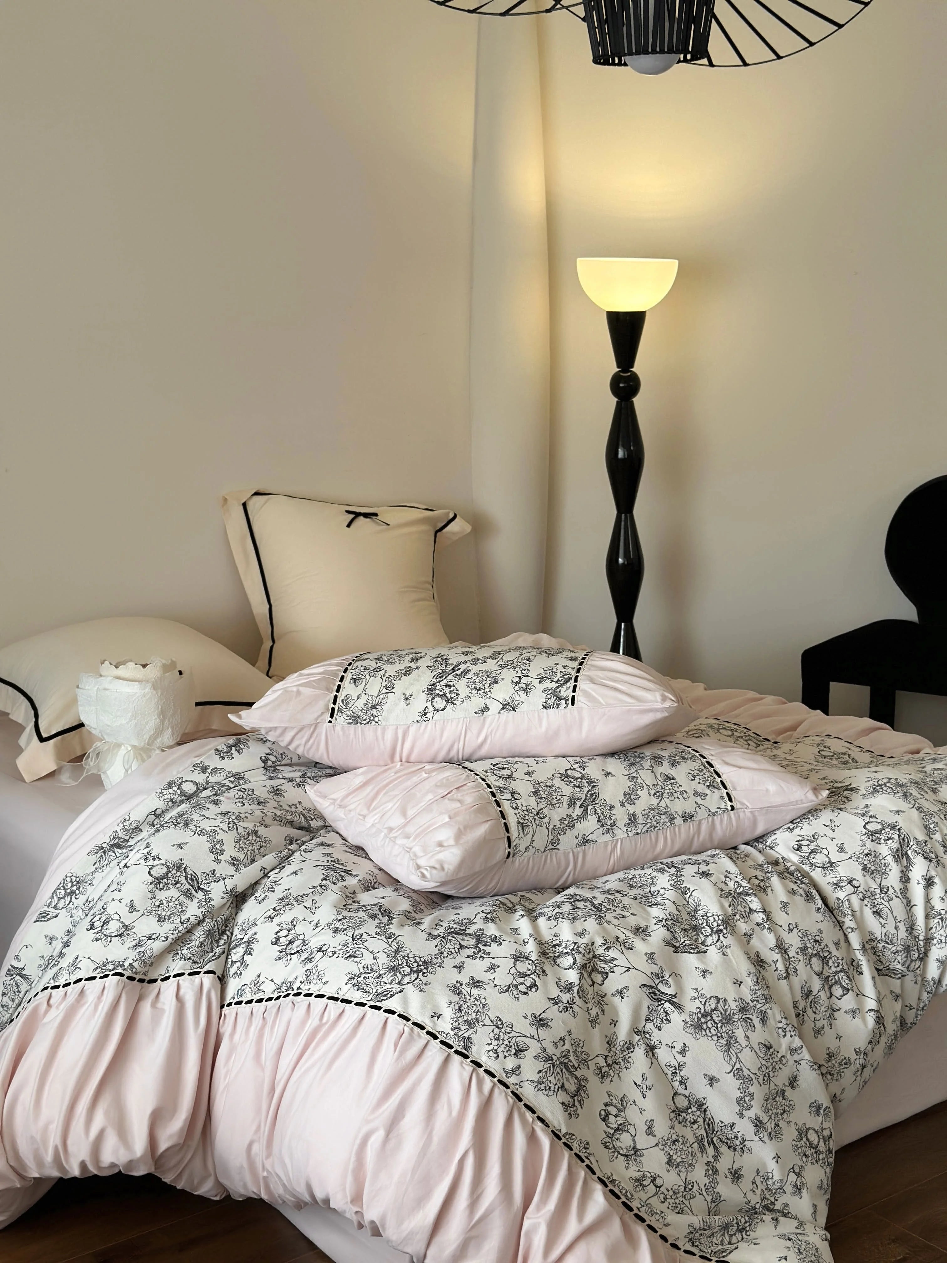 Full view of the Pink Toile bedding set on a bed, highlighting the pink and black color combination. - RoomDen