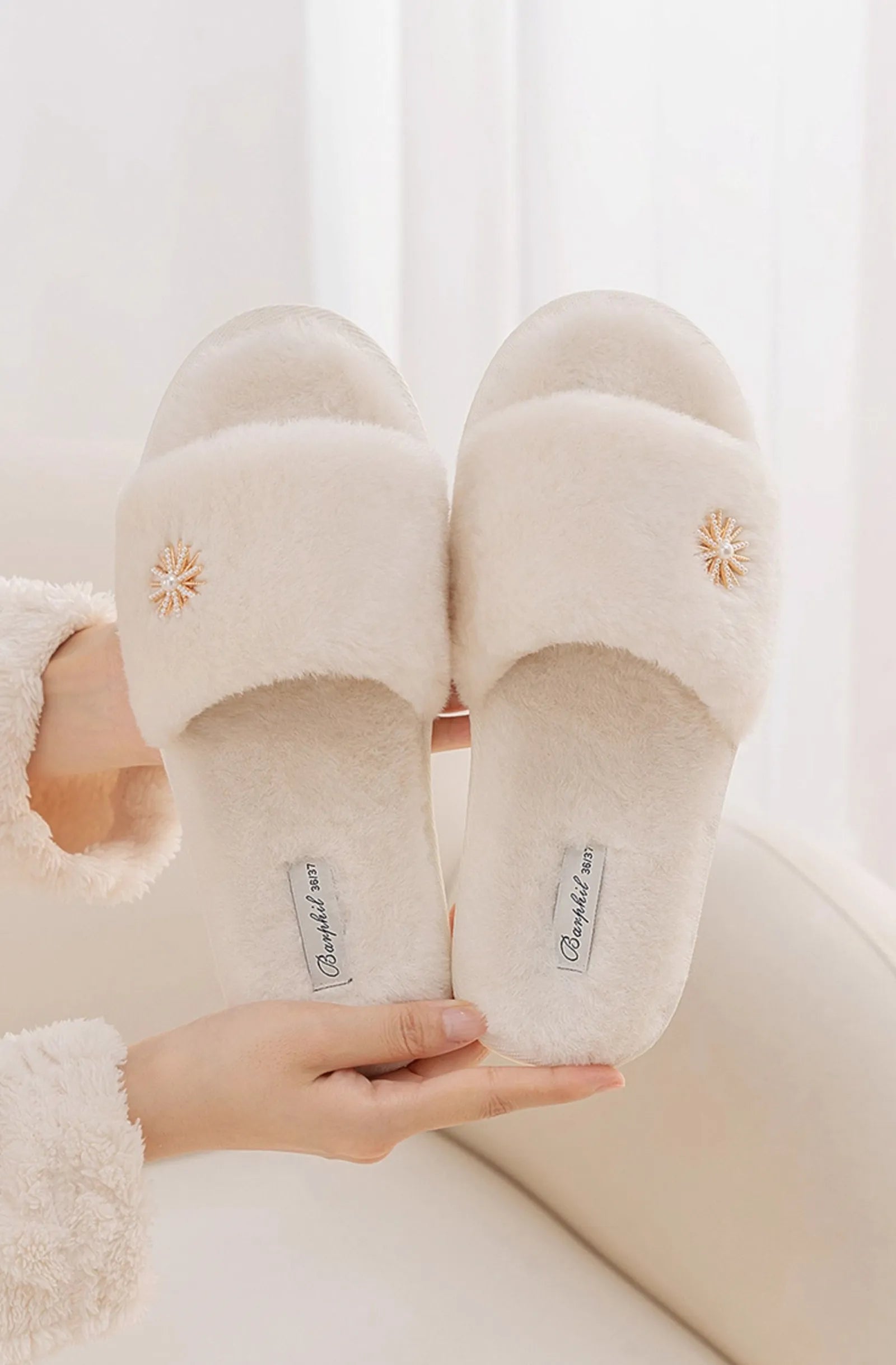 Sole view of Beige Fluffy Slippers showing brand label and non-slip texture - RoomDen