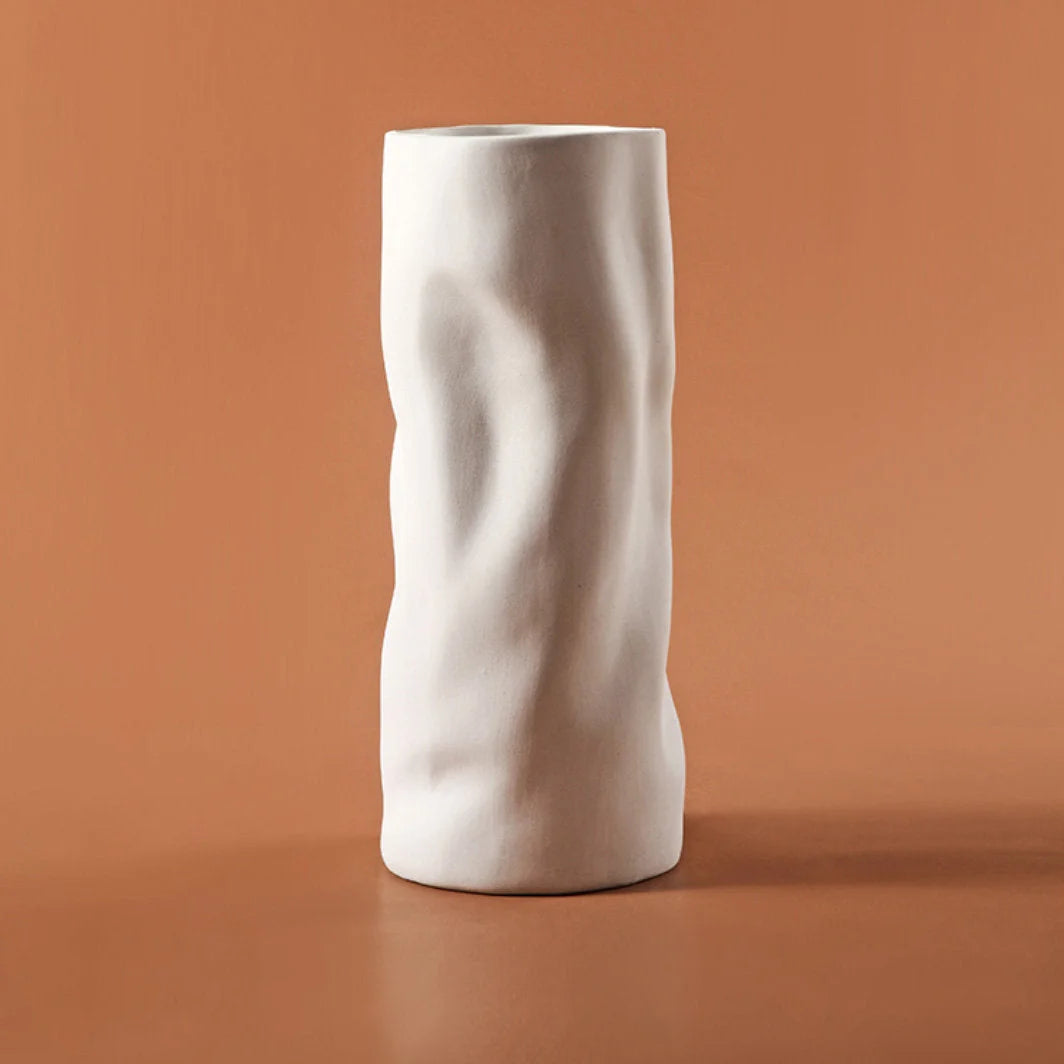 The Ruched Frosted Ceramic Vase shown in a soft, matte Cream white finish - RoomDen.