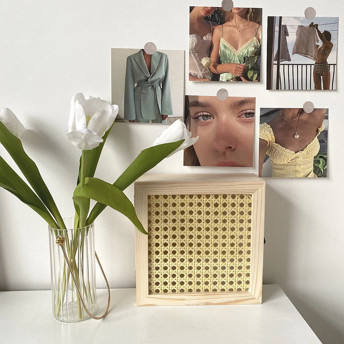 Close-up of the Journal Aesthetic Wall Collage Kit with a light wood rattan box and tulips - RoomDen