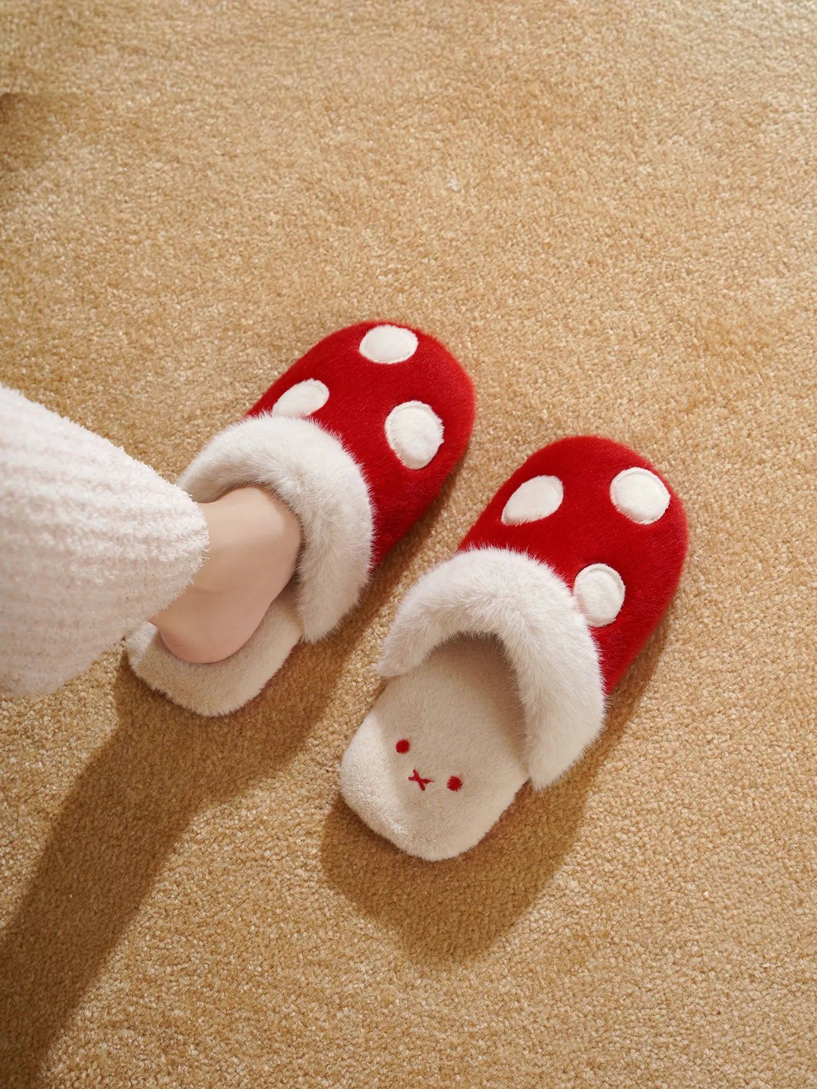 Woman wearing red polka dot fuzzy house slippers - RoomDen