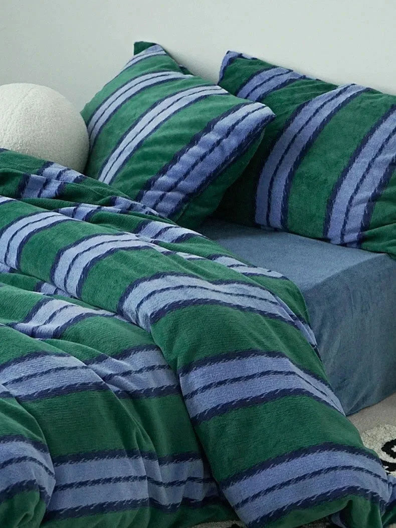 Close-up of the Plush Bold Striped Velvet Bedding Set in emerald green and blue - RoomDen.