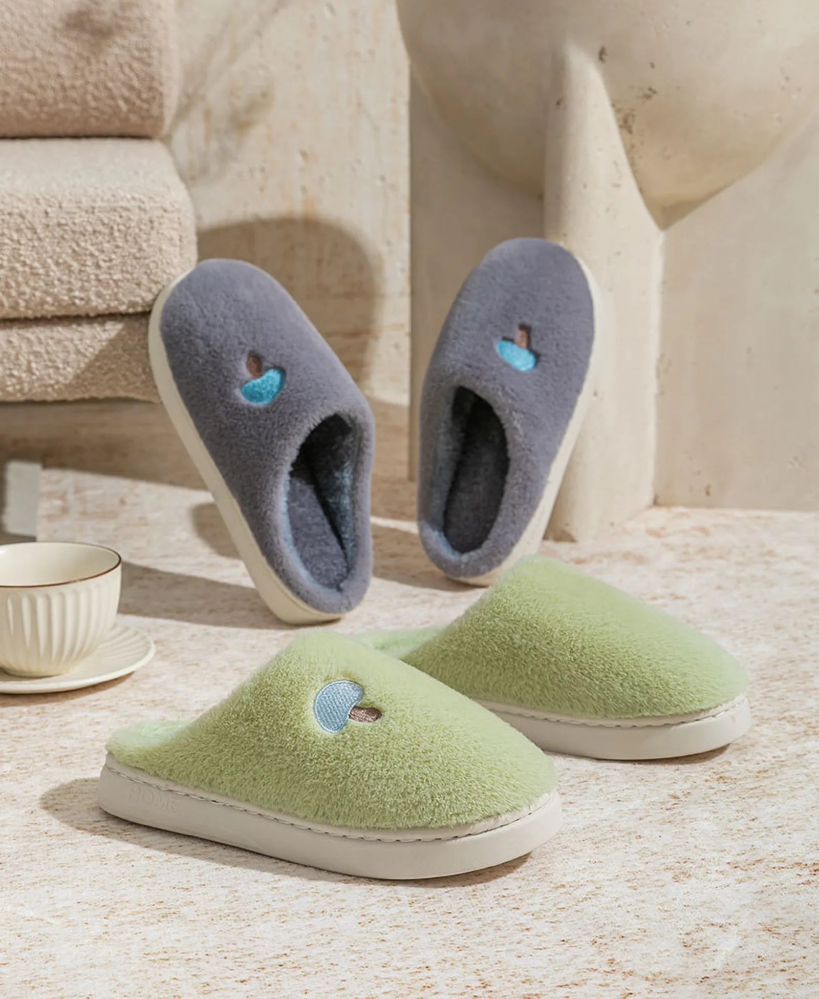 Grey and Green Plush Mushroom Embroidered Fleece House Slippers displayed in a modern room setting - RoomDen