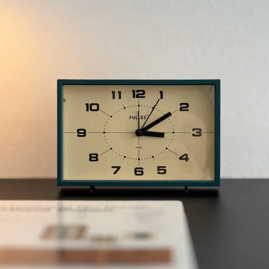 Front view of the Forest Green Retro Table Clock's face and hands.