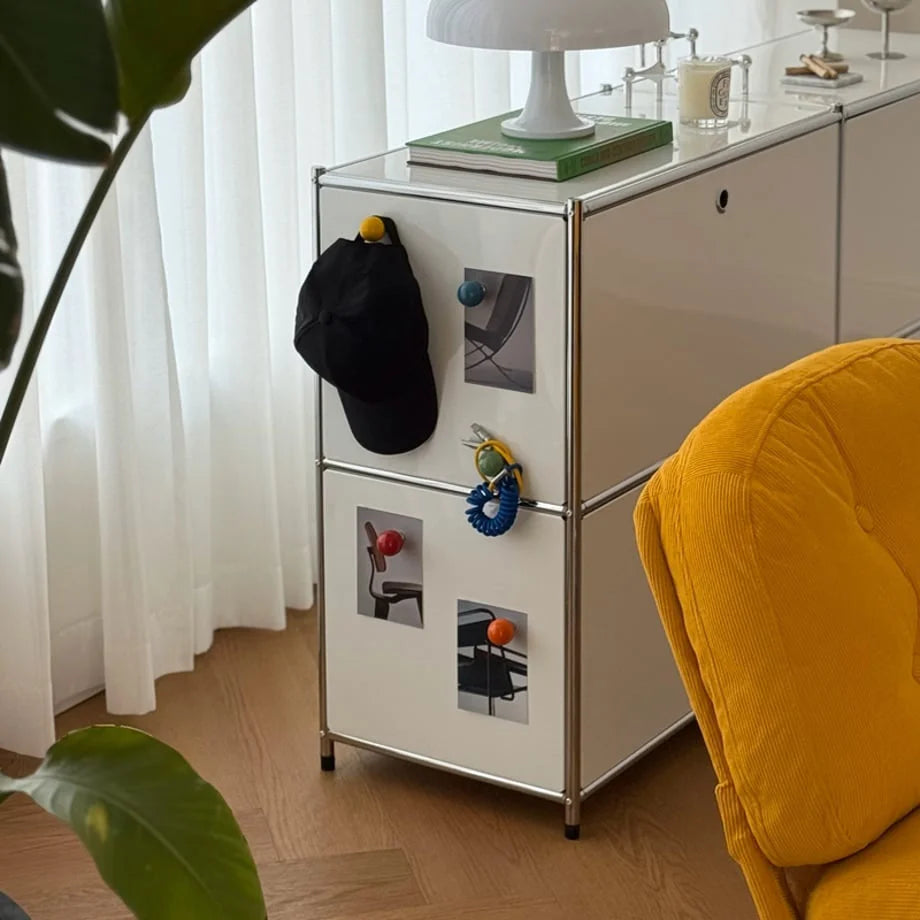 Smooth Ball-Shaped Magnetic Hooks in various colors on a white metal cabinet. - RoomDen