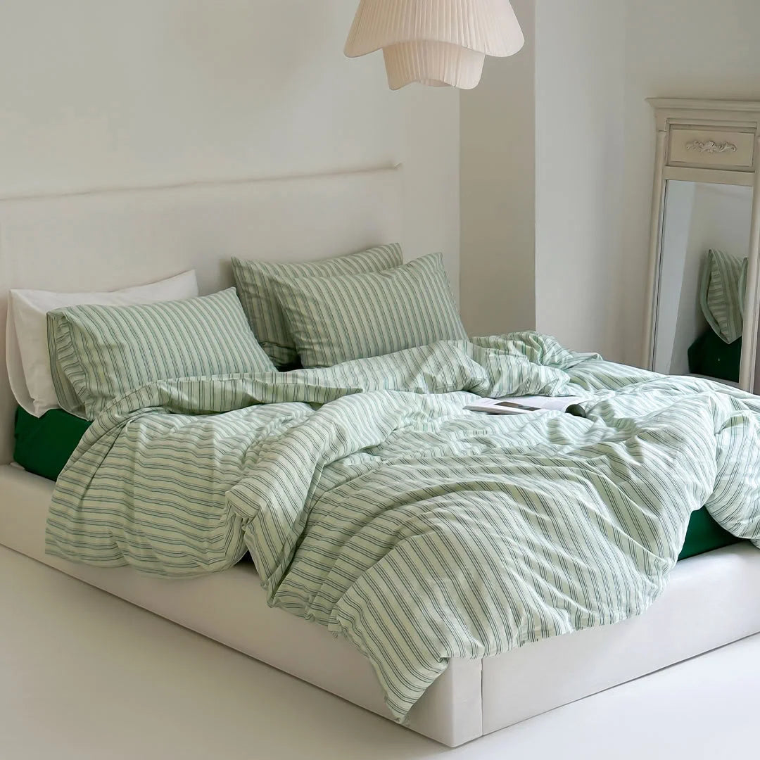Full View of Green and White Striped Bedding Set in Minimalist Bedroom - RoomDen