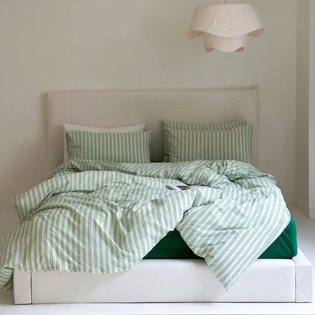 Sage Green Pinstripe Duvet Cover Set on Bed with White Headboard - RoomDen