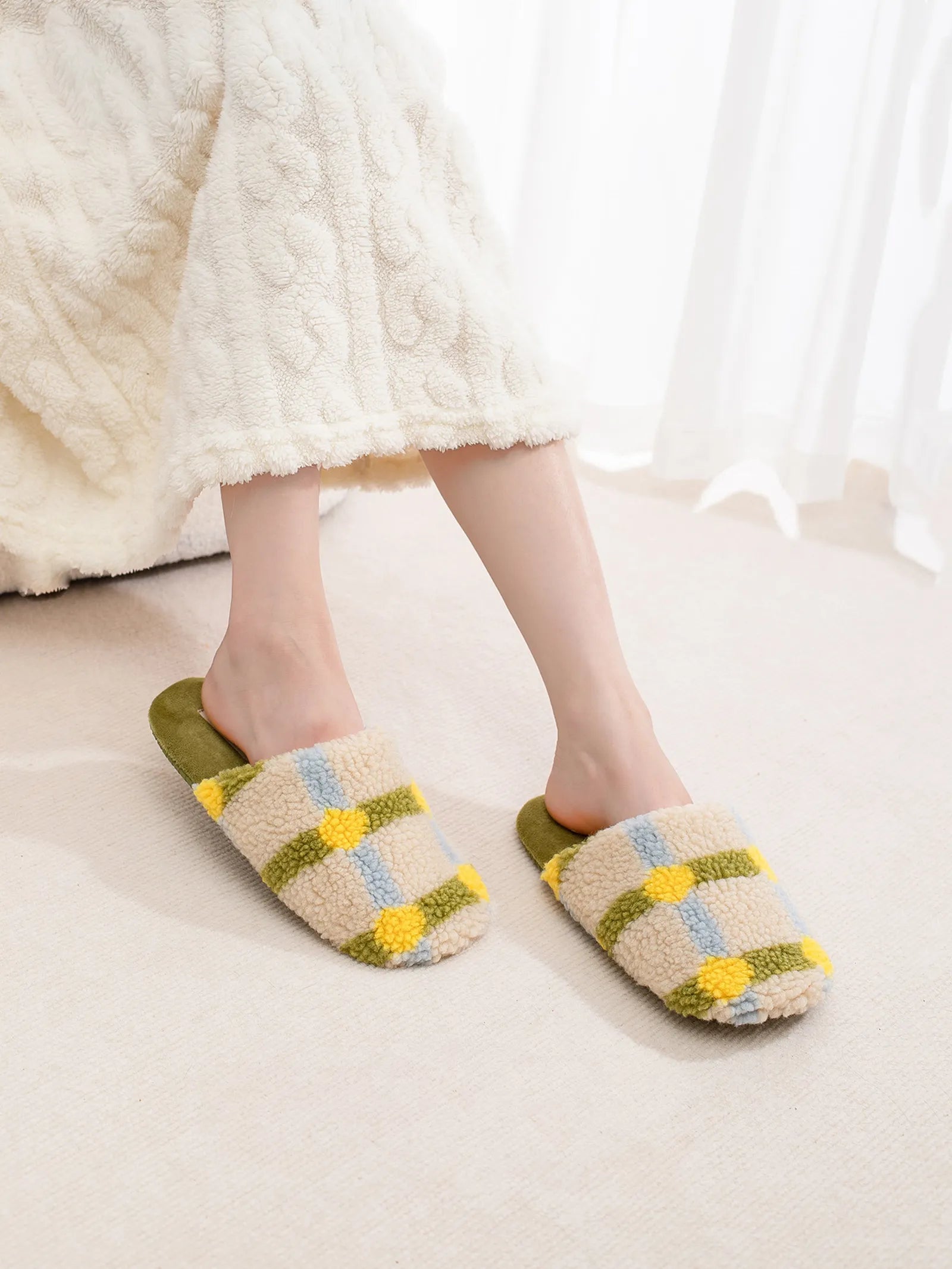 Model wearing Sage Green and Yellow Plaid Sherpa House Slippers with white lounge pants - RoomDen