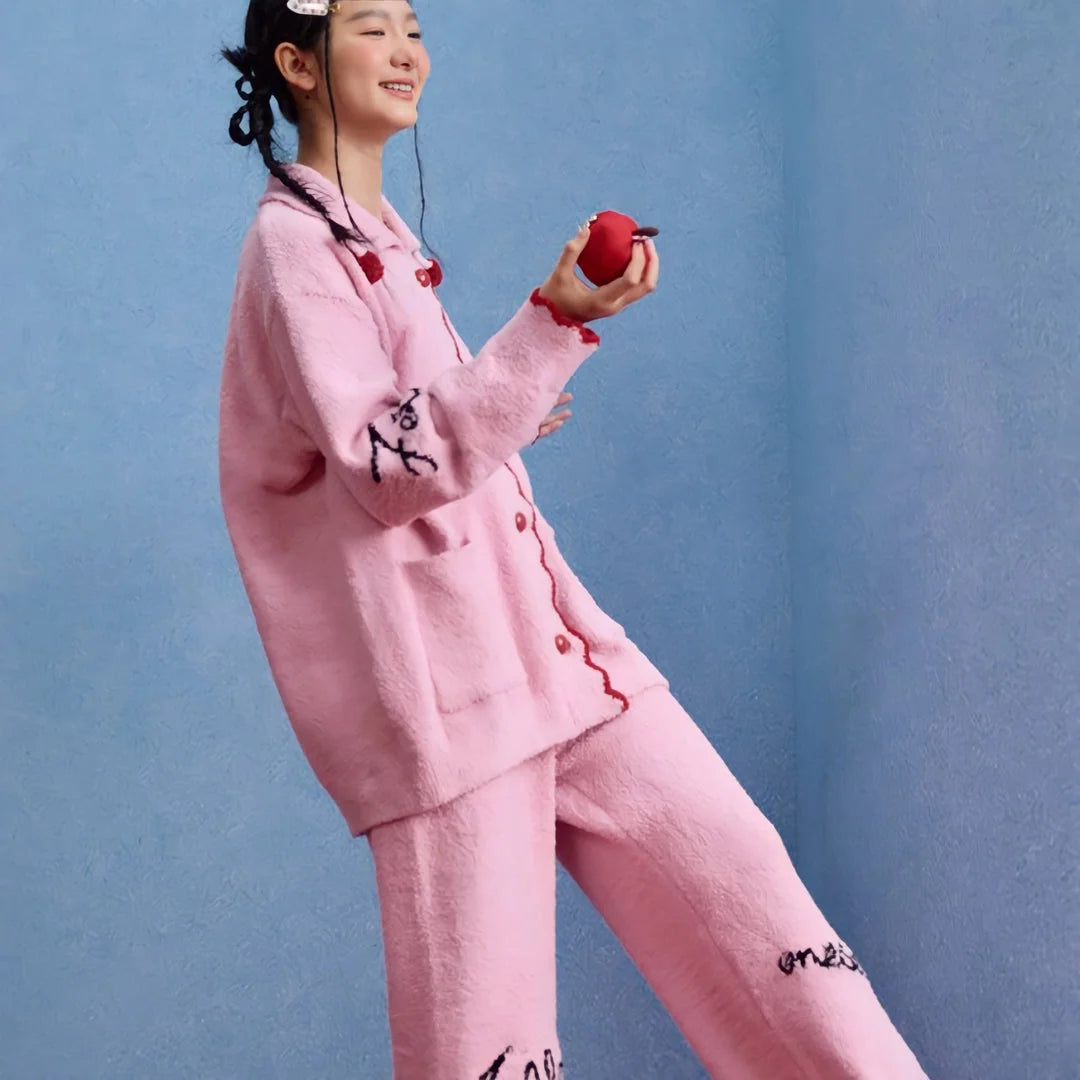 Full view of the Bubblegum Pink fleece pajama set, showing its relaxed and playful fit. - RoomDen