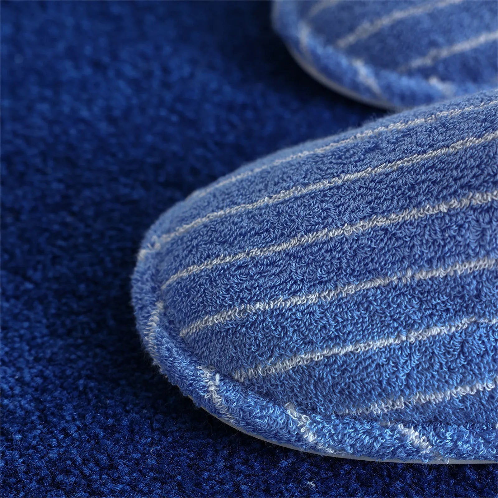 Close up detail of blue terry cloth texture with white pinstripes