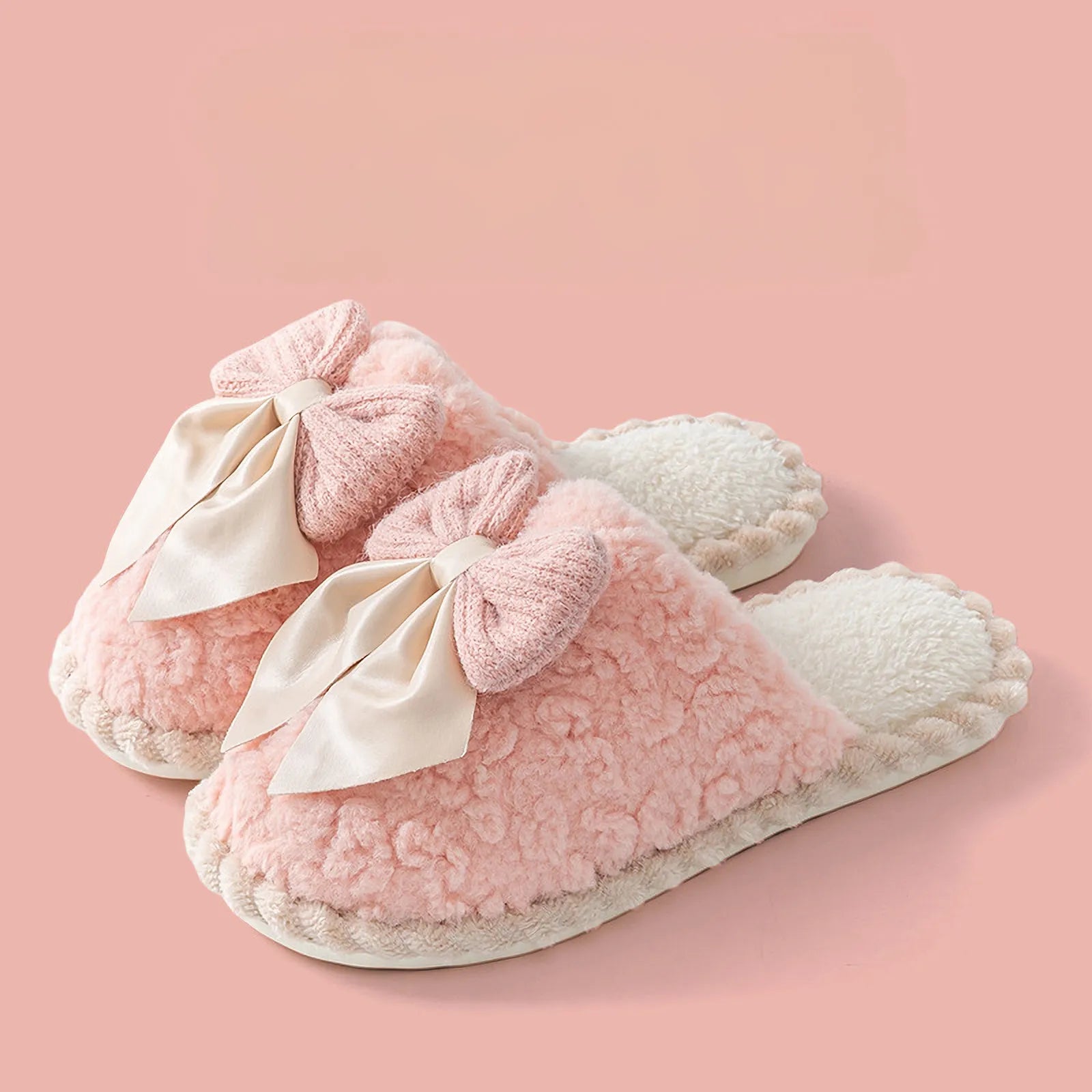 Pair of Pink Coquette style fuzzy slippers with large bows isolated - RoomDen