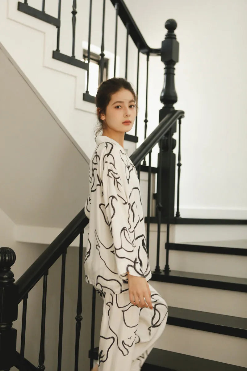 Side Profile of Silky White Button-Down Pajama Top and Pants