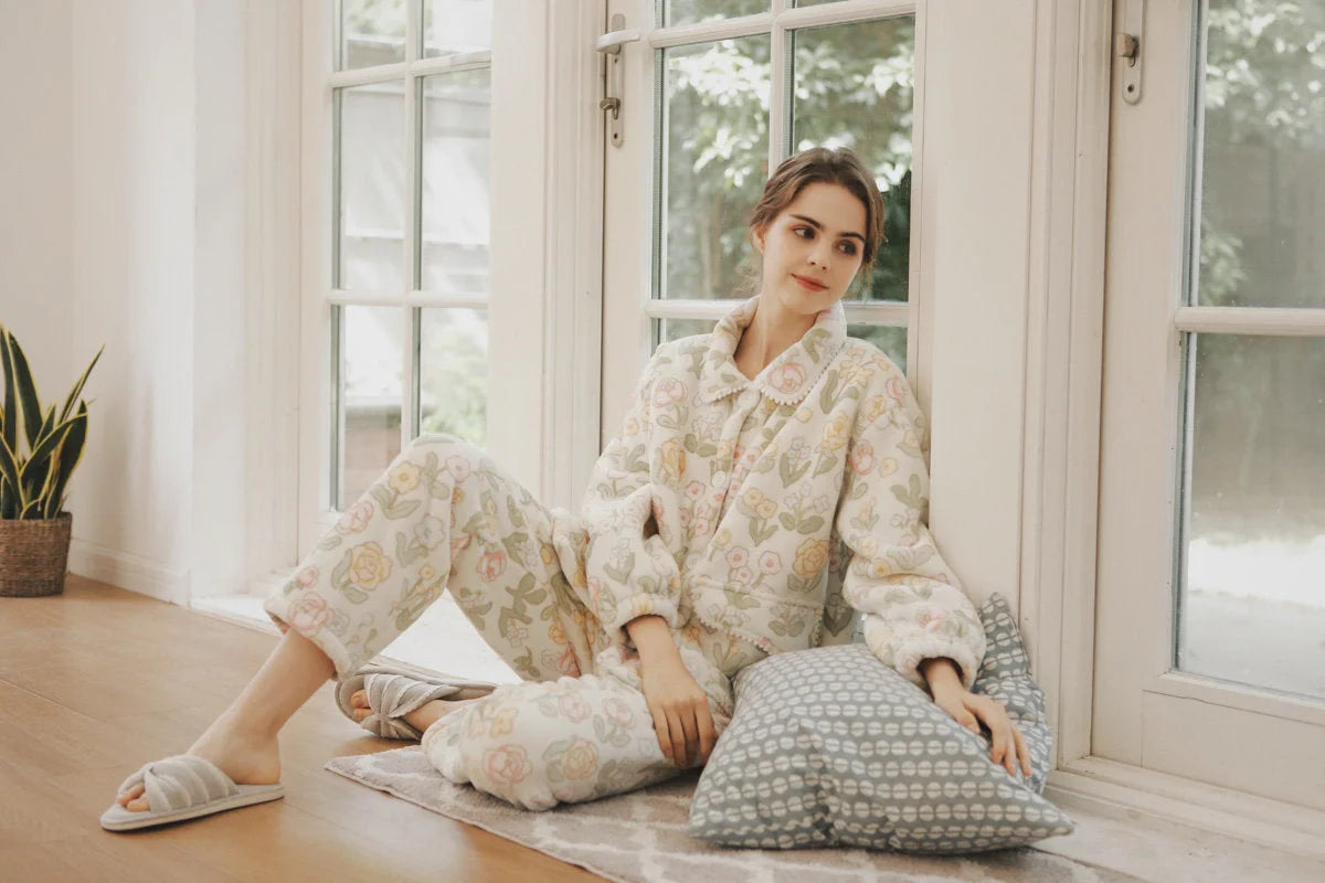 Beige Floral Flannel Fleece Pajama set worn by model sitting on floor - RoomDen