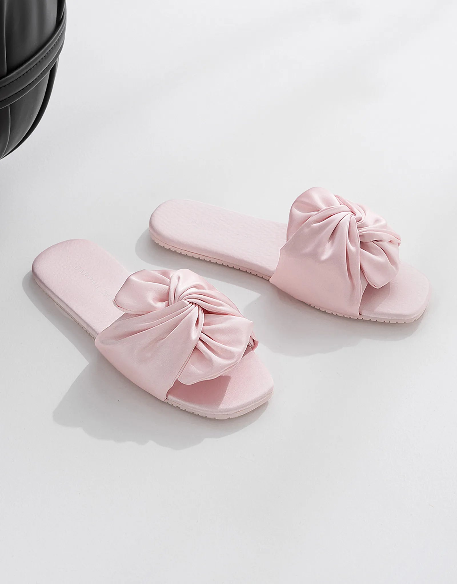 Pair of Blush Pink Satin Finish Bow Slides on white background - RoomDen
