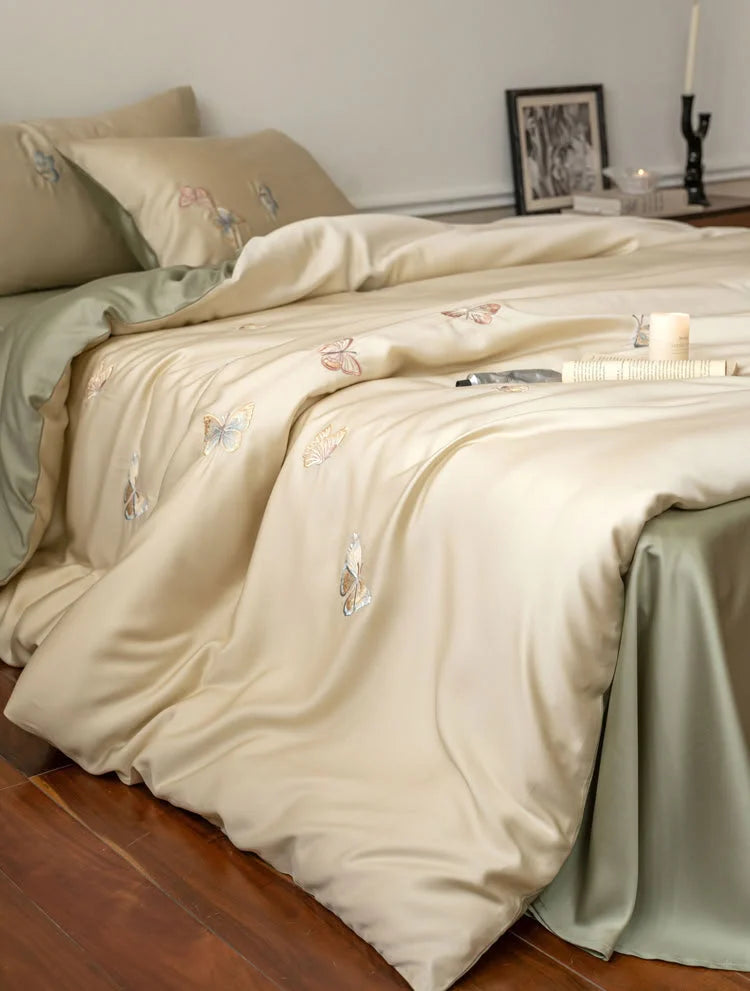 Side view showcasing the lustrous sheen of the Tencel duvet cover with butterfly details - RoomDen