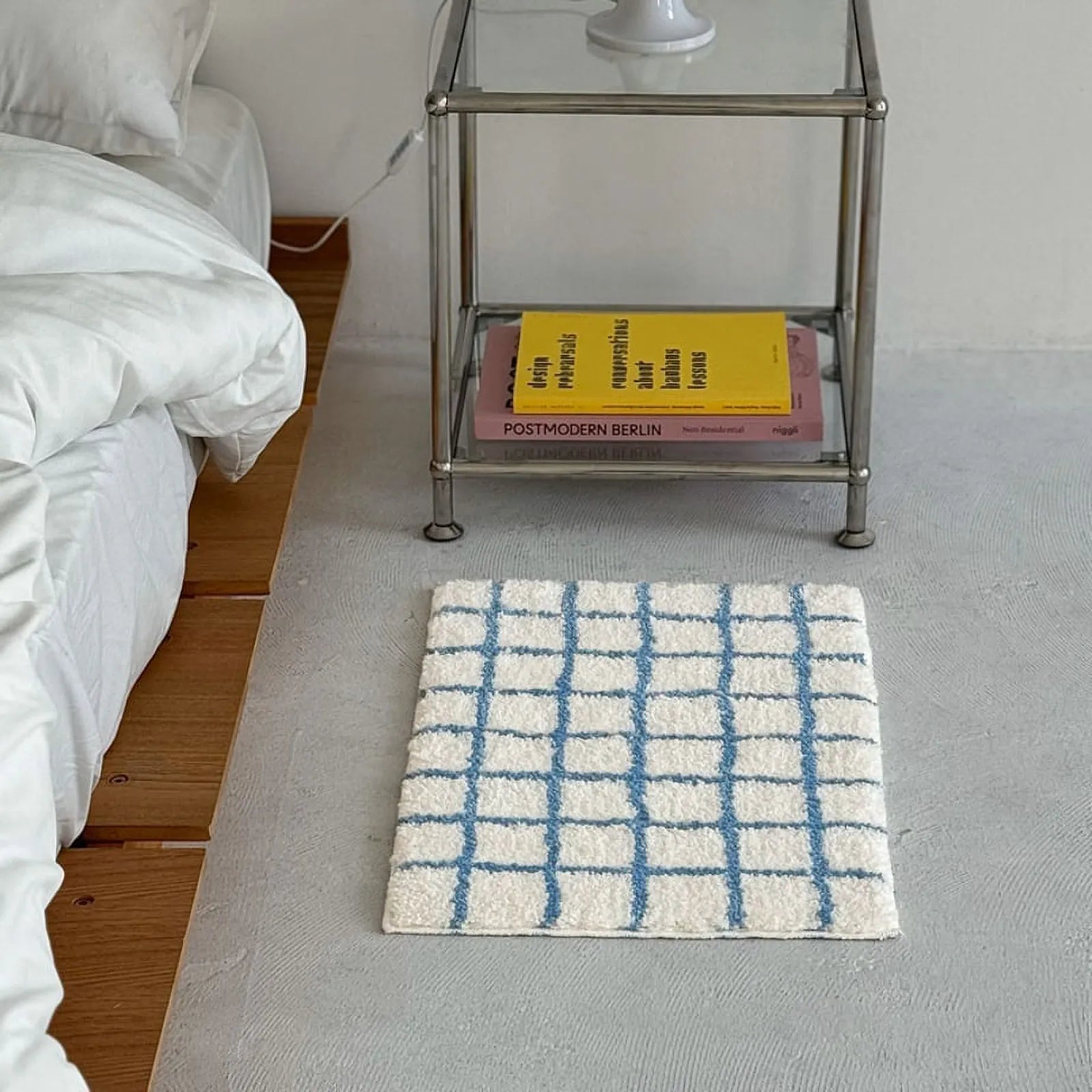 Soft Shaggy Grid Rug Placed Next to Silver Nightstand and White Bedding - RoomDen