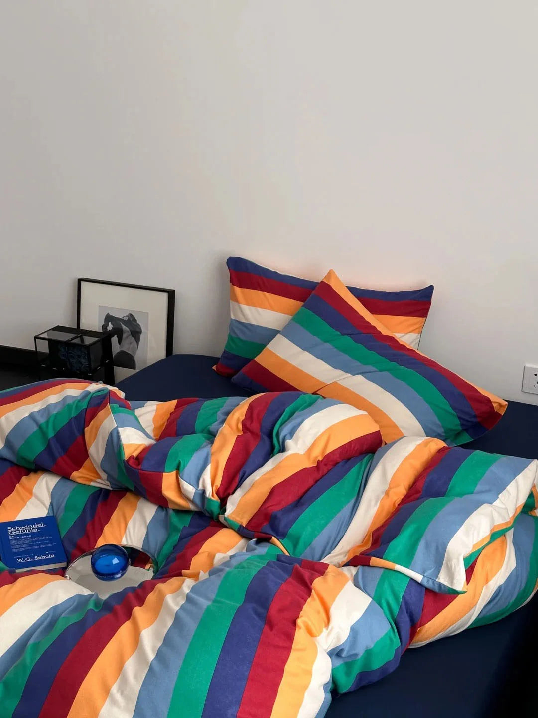 Full view of the Bold Rainbow Stripe Washed Cotton Bedding Set on a bed, showing the fluffy duvet and two matching pillowcases - RoomDen
