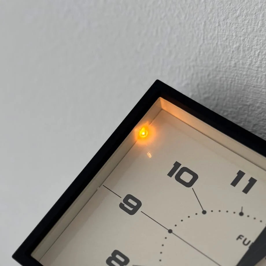 Close-up showing the small, warm LED night light on the Matte Black table clock.