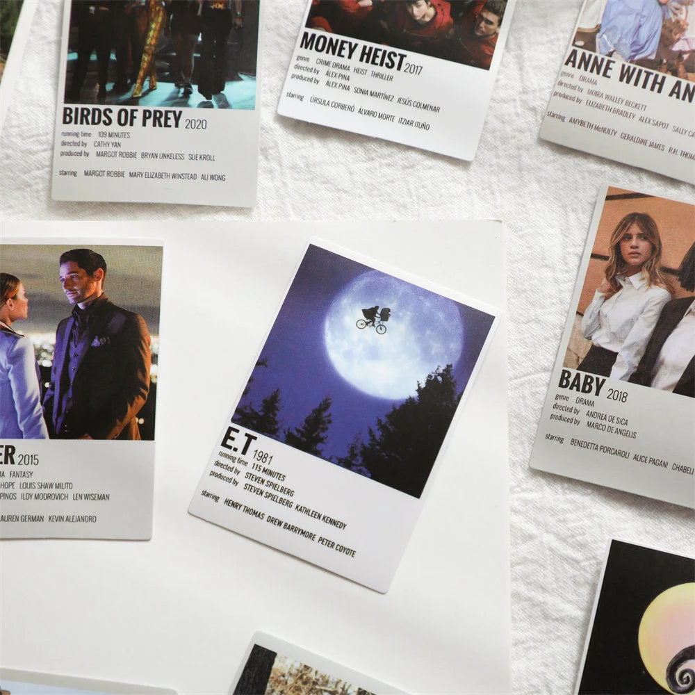 Close-up of minimalist movie poster prints for E.T., Birds of Prey, and Money Heist from a wall collage kit - RoomDen.