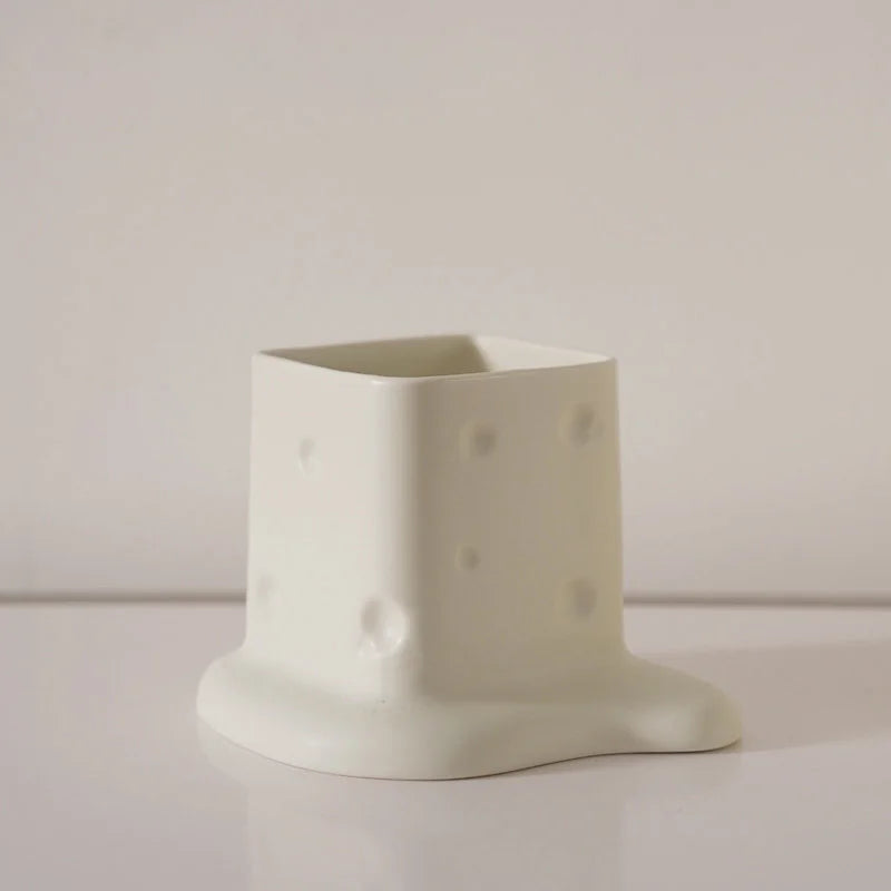 Close-up of the Cream White melting cheese ceramic desktop organizer on a white background. - RoomDen