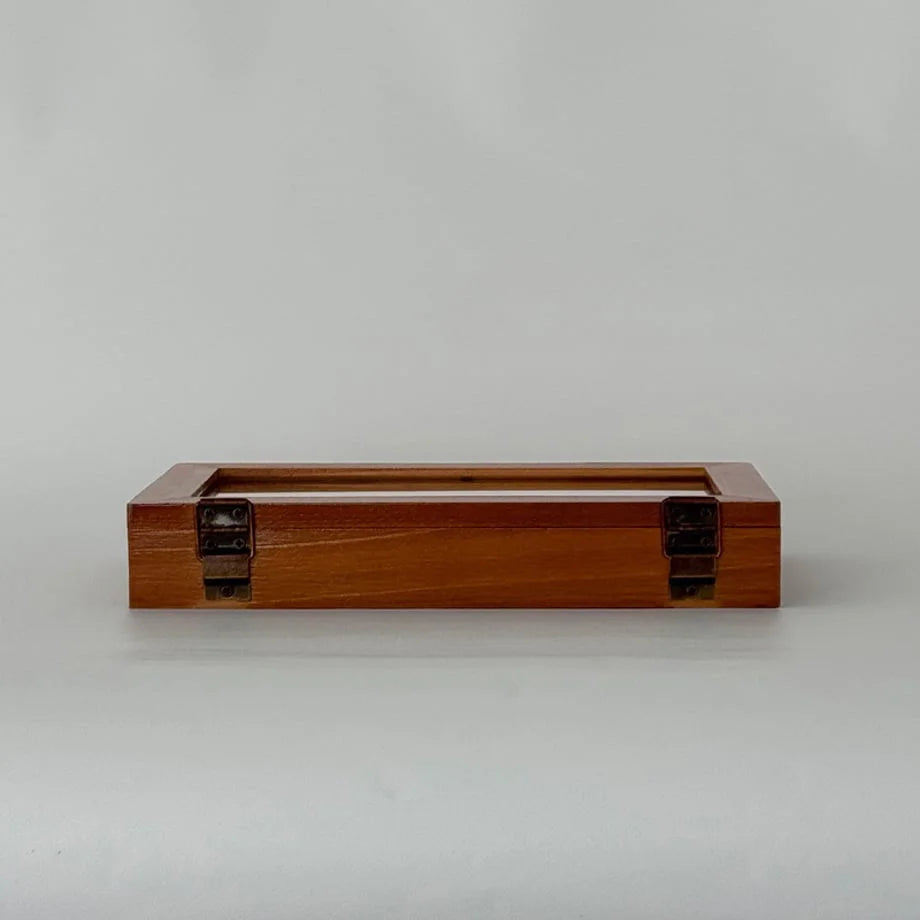 A back view of the closed wood jewelry organizer, showing the metal hinges, against a plain white background.