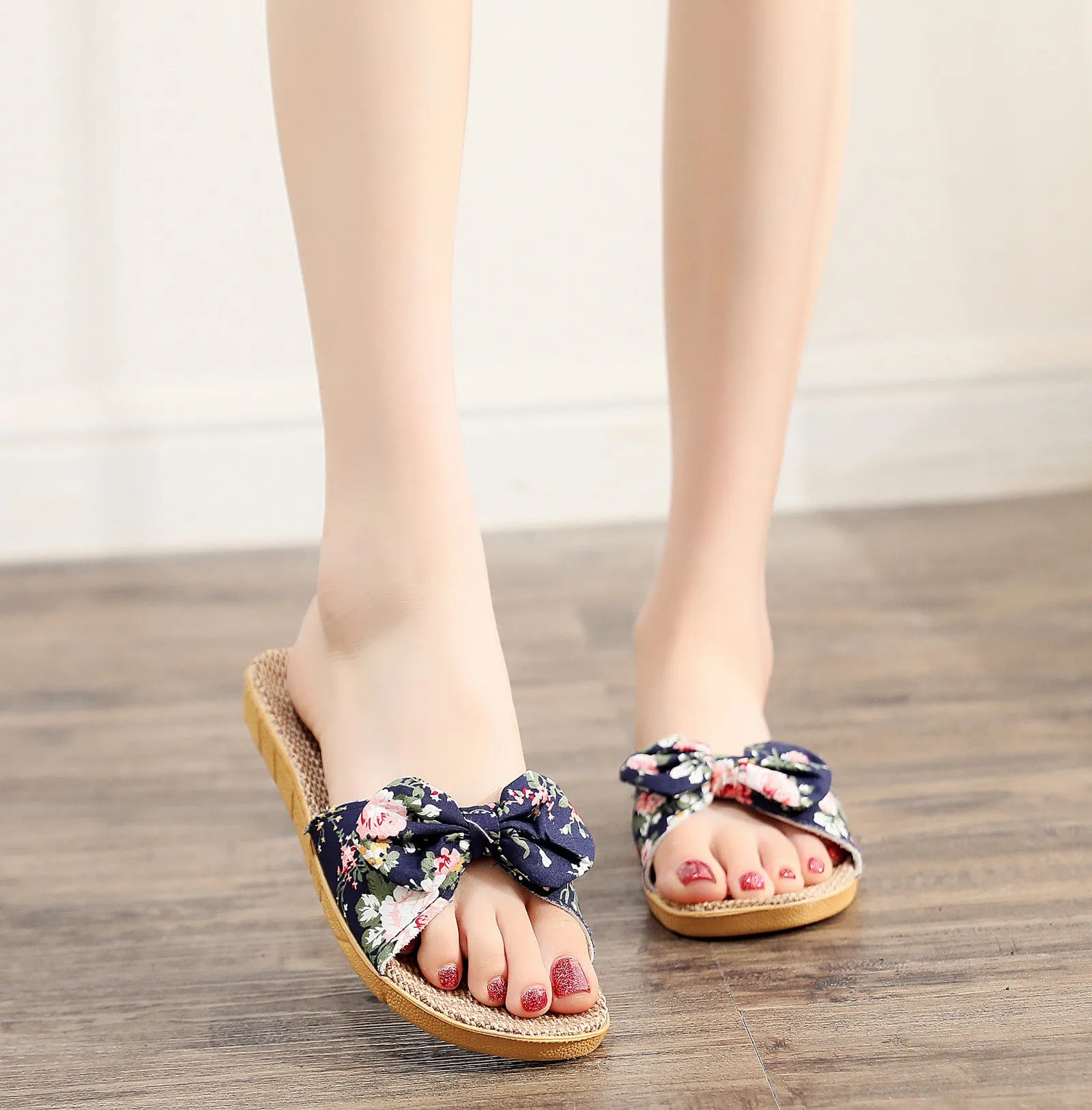 Model wearing Navy Floral Linen House Slippers with red flower print - RoomDen