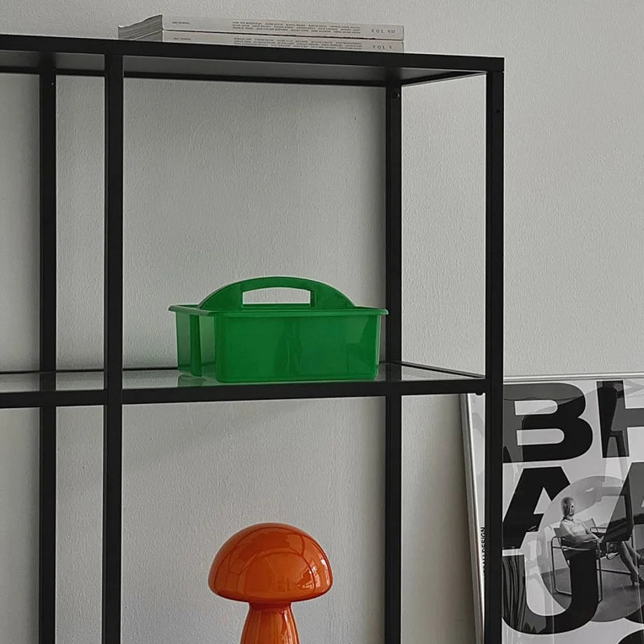 Green portable organizer caddy on a black metal shelf. - RoomDen