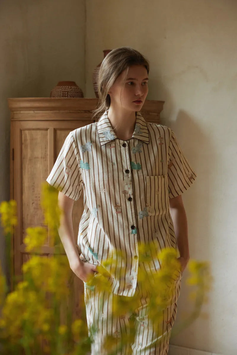 Close up of Whimsical Elephant and Carousel Print on Beige Striped Fabric - RoomDen