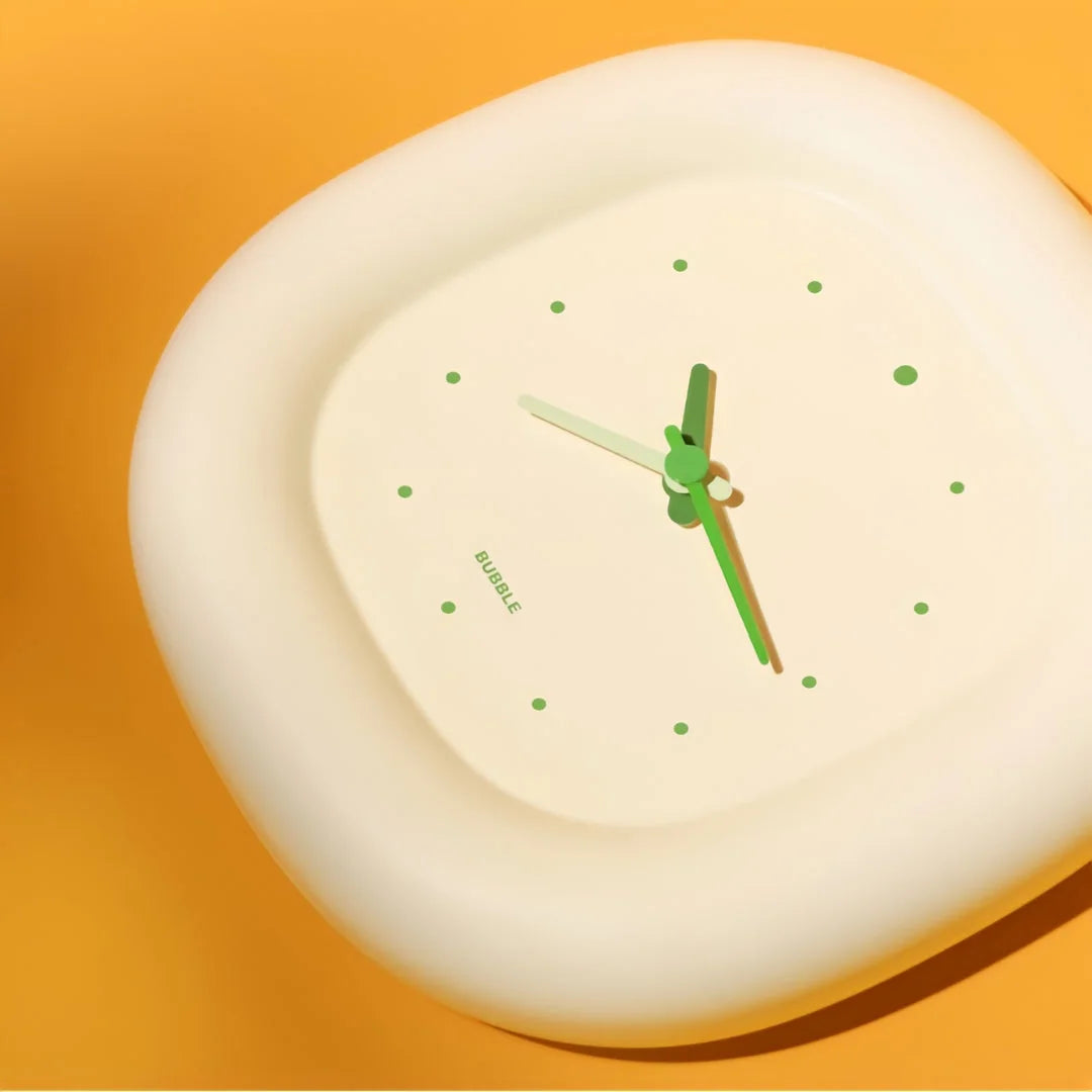 Angled view of the Creamy Beige Puffy Bubble Table Clock, highlighting its soft, rounded shape - RoomDen