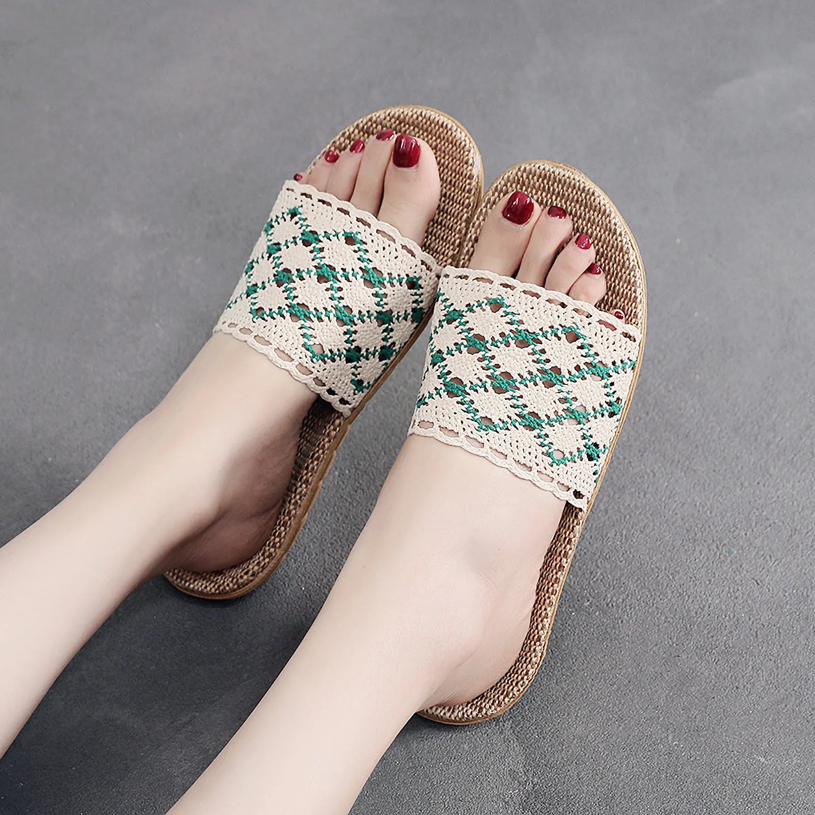 Close up of white and red geometric knit pattern on feet - RoomDen
