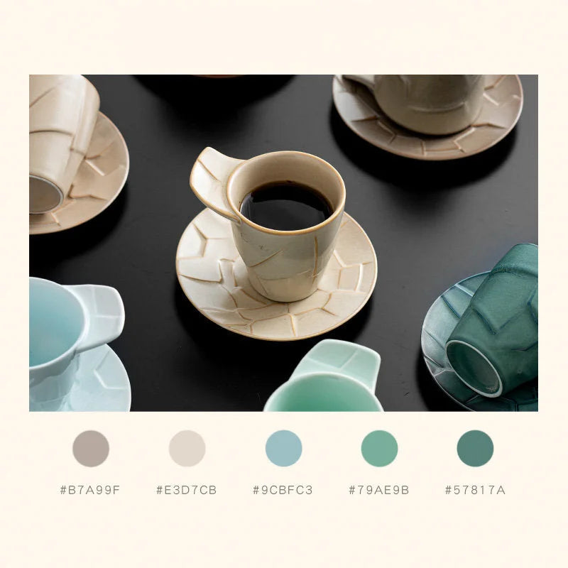 Lifestyle image showing multiple color variants of the Textured Geometric Ceramic Cups on a table - RoomDen