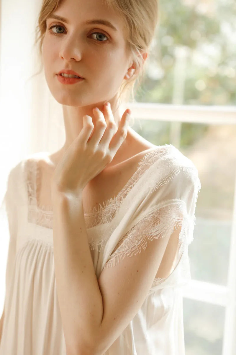 Close up of square neckline and eyelash lace on white pajama dress - RoomDen